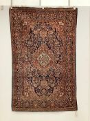 An Isphahan pink medallion rug, with a blue field, 200 x 130cm***CONDITION REPORT***PLEASE NOTE:-