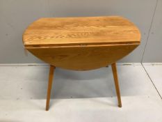 An Ercol elm drop leaf dining table, width 102cm, depth 64cm, height 71cm