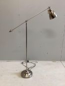 A Contemporary chrome adjustable floor lamp