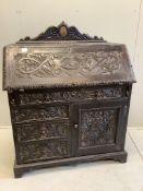 A late 19th century Flemish carved oak bureau, width 100cm, depth 49cm, height 133cm. Condition -