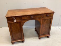An early Victorian mahogany kneehole dressing table, width 107cm, depth 48cm, height 79cm. Condition