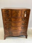 A reproduction George III style mahogany serpentine chest of nine drawers, width 76cm, depth 51cm,
