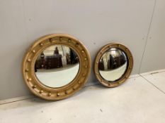Two Regency style circular giltwood and composition convex wall mirrors, larger diameter 58cm.