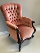 A Victorian mahogany upholstered spoon back armchair, width 70cm, depth 70cm, height 100cm.