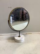 A mid century brass framed swivel toilet mirror, on circular marble base, height 48cm. Condition -