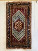 A North West Persian rug, 182 x 101cm. Condition - fair