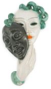 An Art Deco tin-glazed terracotta theatrical wall mask, by Goldscheider, black printed mark ‘