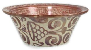 Ulisse Cantagalli, a large Hispano-Moresque style ruby-copper lustre basin, c.1900, decorated with