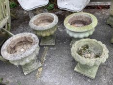 Four (three plus one) circular reconstituted stone garden planters, larger diameter 40cm, height