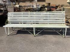 An early 20th century painted wrought iron slatted garden bench, width 244cm, depth 62cm, height