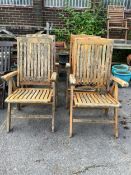 A set of four stained teak folding garden armchairs. Condition - poor