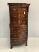 A George III style mahogany narrow serpentine chest on chest with slide, width 63cm, depth 48cm,