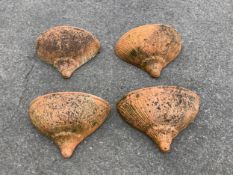 A set of four weathered terracotta wall pockets, width 44cm, depth 19cm, height 30cm. Condition -