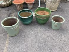 Four circular glazed earthenware garden planters, largest diameter 38cm, height 32cm. Condition -