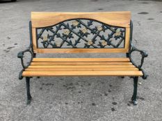 A Victorian style cast metal and slatted wood garden bench, width 130cm, height 90cm. Condition -