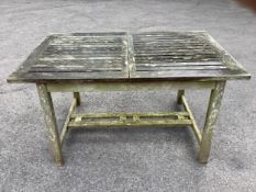 A Westminster rectangular weathered teak extending garden table, width 140cm, depth 90cm, height