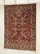 A North West Persian brick red ground rug, 200 x 148cm. Condition - fair