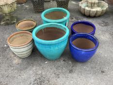 Six (three pairs) circular glazed earthenware garden planters, largest diameter 38cm, height 32cm.