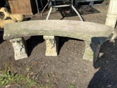 A large reconstituted stone curved garden bench, width 160cm, depth 39cm, height 42cm. Condition -