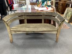 A Gaze Burvill steam bent oak “Court” garden bench, width 146cm, depth 58cm, height 79cm.