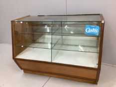 A mid century glazed haberdasher's shop counter cabinet, width 123cm, depth 60cm, height 92cm.