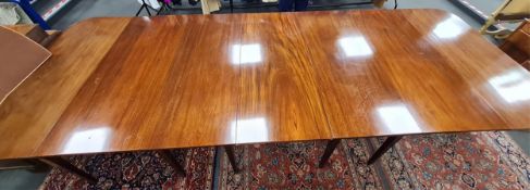 A George III mahogany extending dining table, width 396cm extended, depth 137cm, height 74cm.