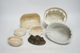 From the Studio of Fred Cuming. Seven jelly moulds including six ceramic examples, one Cetemware,