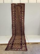 A Caucasian fawn ground runner, 405 x 99cm. Condition - fair