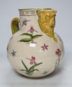 From the Studio of Fred Cuming. A large crackle glaze pottery mask jug, 29cm high. Condition -