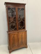 A George III style mahogany bookcase cupboard, width 86cm, 36cm, height 203cm. Condition - fair
