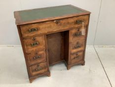 An 18th century and later inlaid walnut kneehole desk, width 77cm, depth 46cm, height 75cm.
