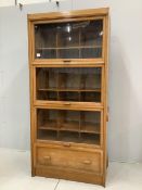 A mid century glazed oak haberdasher's cabinet, width 92cm, depth 50cm, height 198cm. Condition -