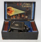 From the Studio of Fred Cuming. Vintage E.P. magic lantern and slides, cased. Condition - fair Note: