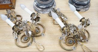 A pair of two branch gilt painted metal wall lights with lustre drops, approximately 44cm high.