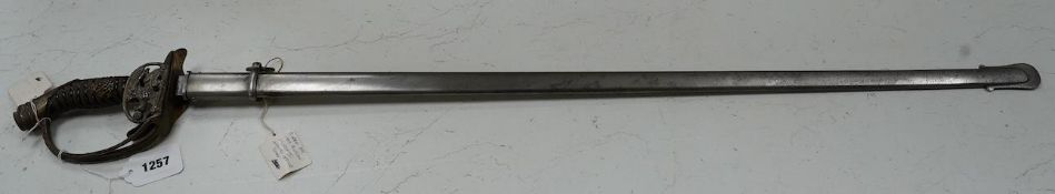 An 1889 Wilhelm II Prussian infantry officer’s sword with folding side guard, in a steel scabbard,