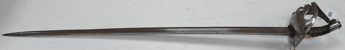 An 1880s French cavalry sword with horn grip and seven bar pierced steel guard, blade 88cm.