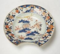 A Japanese Arita ‘cranes and chicks’ barber's bowl, early 18th century, in Imari palette, 7cm in