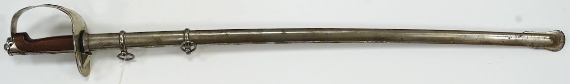 An Italian WWI cavalry trooper’s sword, pipe back blade, pierced guard, wooden grip, in its steel