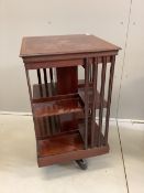An Edwardian inlaid mahogany revolving bookcase, width 47cm, depth 47cm, height 84cm. Condition -