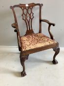 A George III Chippendale style mahogany elbow chair, width 66cm, depth 52cm, height 96cm.