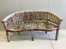 A teak weathered garden banana bench, width 160cm, depth 55cm, height 84cm. Condition - fair