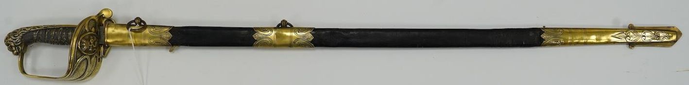 A Victorian warrant officer's sword by Westcott and Sons, regulation brass hilt, black fish skin