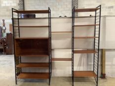 A mid century teak Ladderax shelving unit, width 215cm, depth 35cm, height 201cm. Condition -