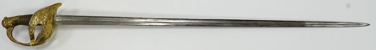 A French 1890 Cuirassier’s sword, brass boat shaped guard with foliage in relief, wirebound horn