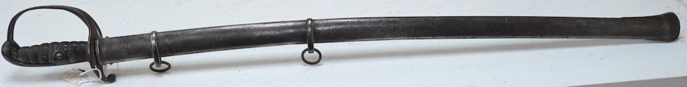 An 1821 pattern British light cavalry trooper’s sword with scabbard, blade 88.5cm. Condition - fair,