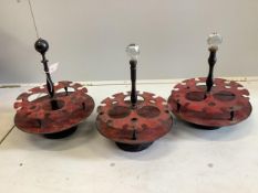 Three early 20th century French toleware and turned beech liqueur stands, diameter 13cm. Condition -