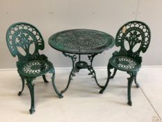 A Victorian style circular painted aluminium garden table, diameter 80cm, height 68cm, together with