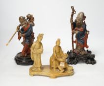 Two Chinese Fuzhou lacquer figures of Shou Lao and a smaller soapstone figure group, tallest