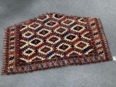 An antique Asmalyk tent door hanging, width 121cm, height 75cm. Condition - fair