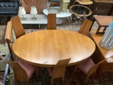 A Gudme Mobelfabrik dining room table, width 164cm, depth 94cm, height 72cm and six chairs.